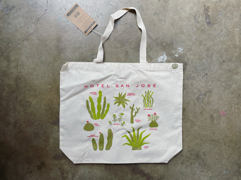 Various cacti adorn an ECOBAG tote that reads 'HOTEL SAN JOSE'
